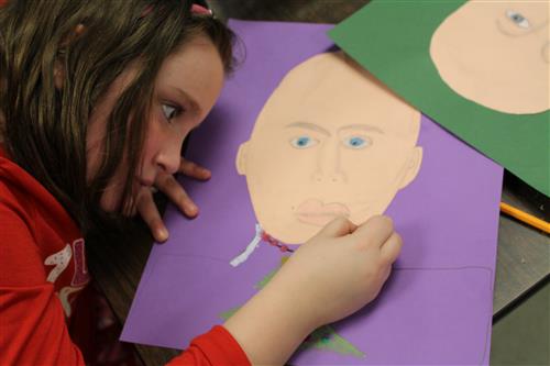 Student drawing her face