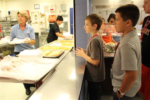 Students being served lunch 