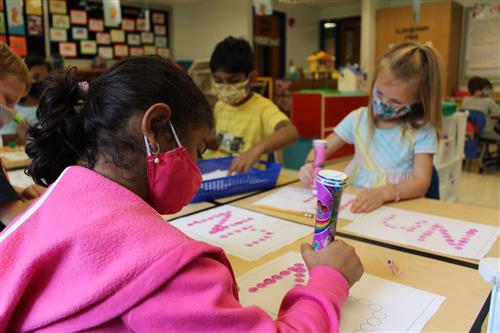 Preschool kids writing
