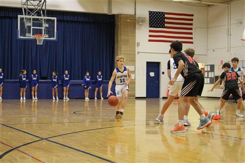 Seventh grader dribbling