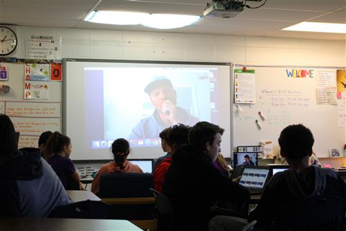 Students talk with Canadian teacher 